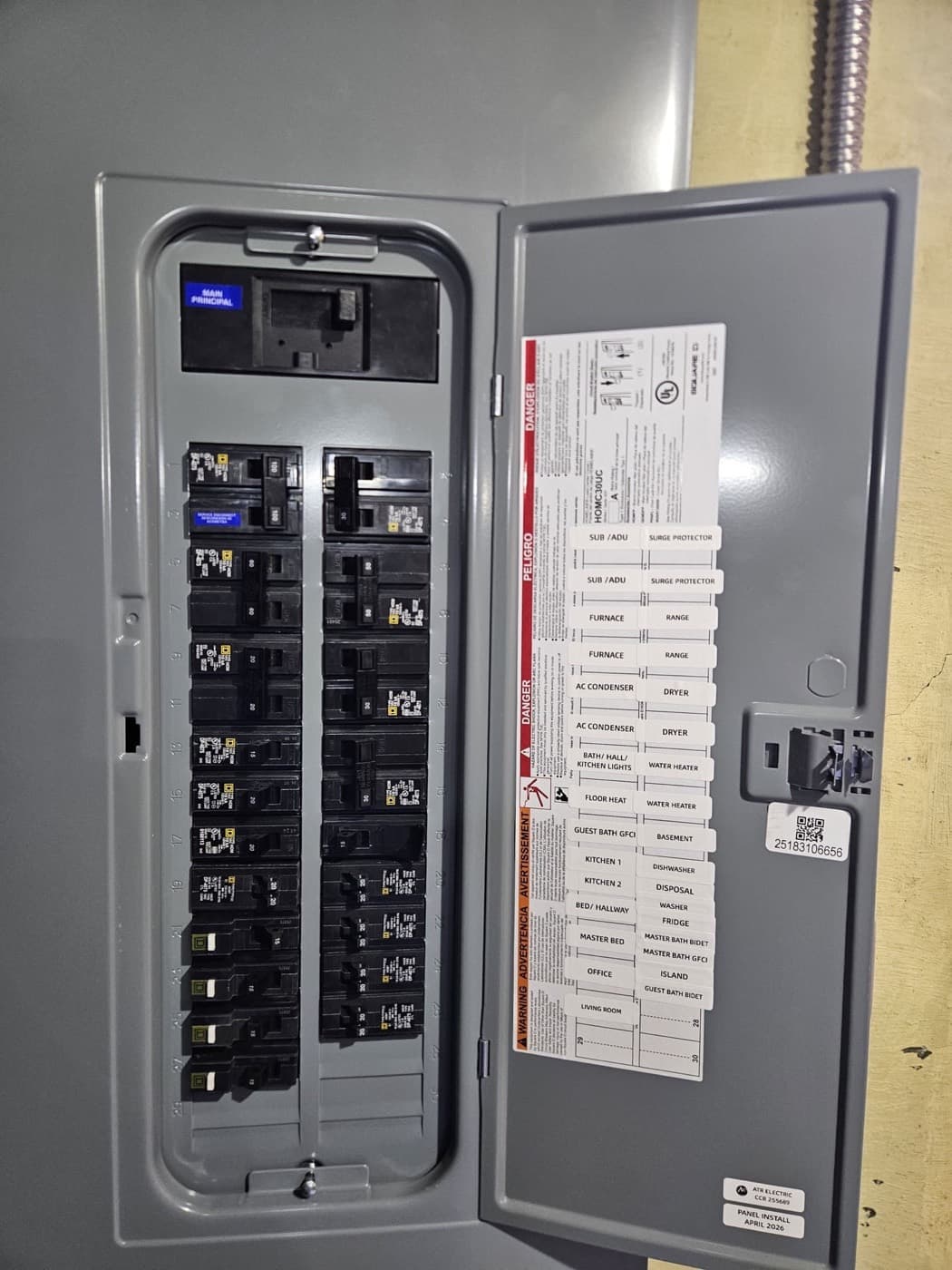 New residential electrical panel with a completed circuit directory inside the door