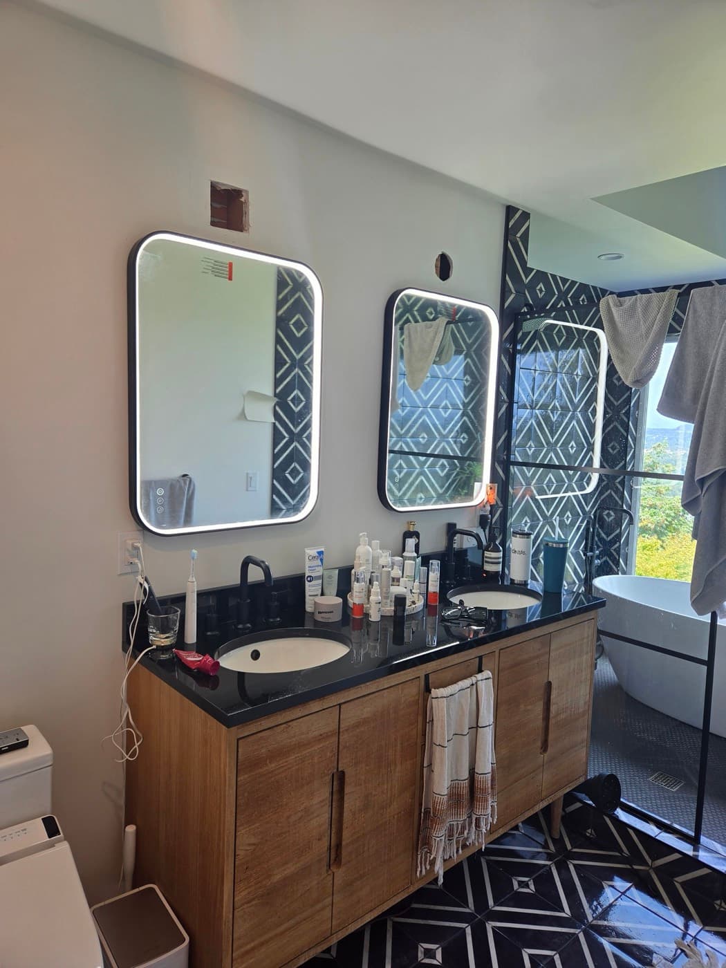 Bathroom remodel wiring with two backlit mirrors over a double vanity
