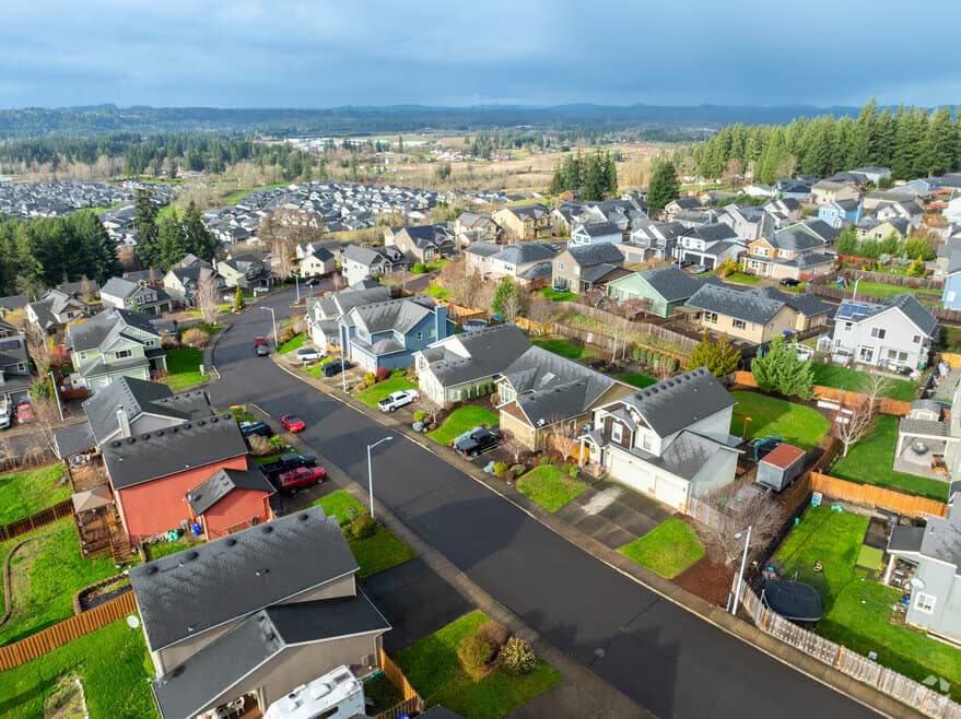 Aerial view of a newer subdivision in Estacada, Oregon, with the Clackamas valley beyond