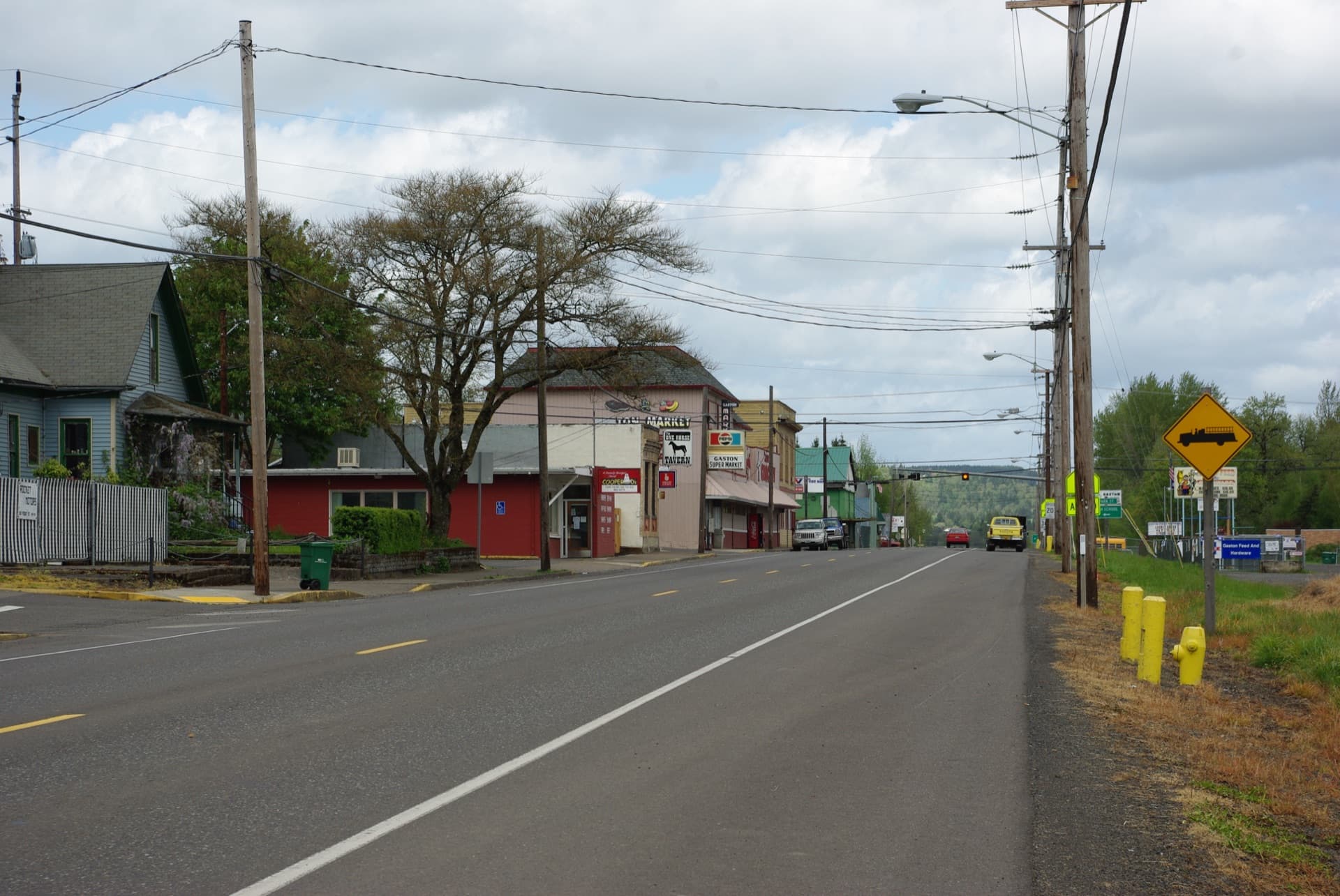 Main Street through Gaston, Oregon, past the Gaston Super Market and the tavern