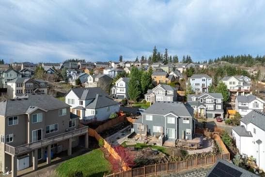 Aerial view of hillside homes stepping down a slope in Happy Valley, Oregon