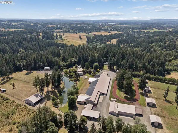 Aerial view of wooded acreage and outbuildings near Rivergrove, Oregon