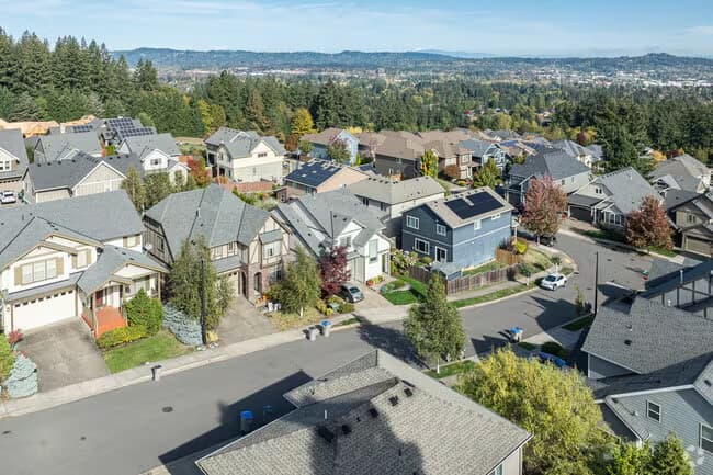 Aerial view of a hillside neighbourhood of newer homes in Tigard, Oregon