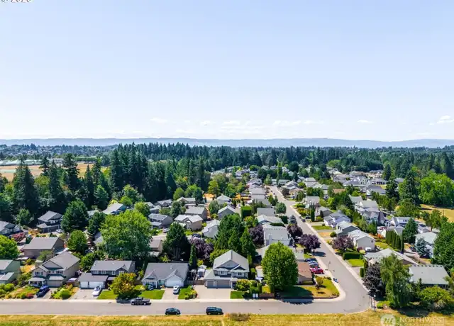Aerial view of a residential street in Vancouver, Washington, with the Cascade foothills behind