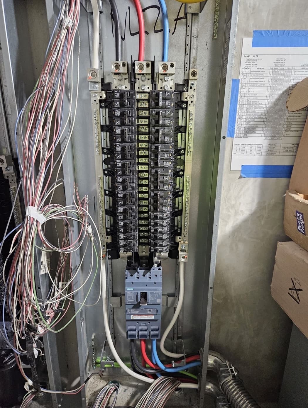 Commercial panelboard terminated out with branch conductors combed and left to length