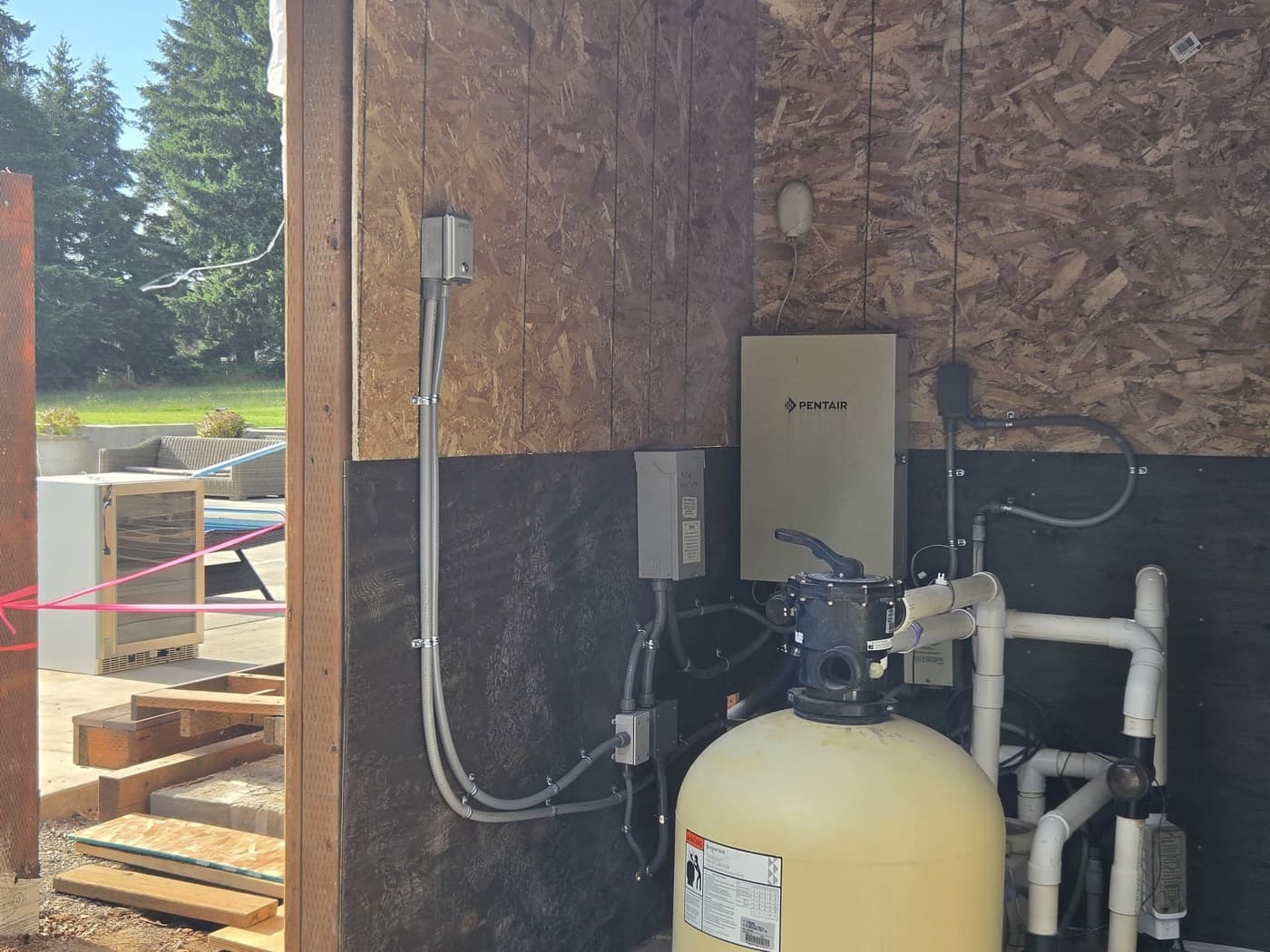 Pool filter and pump with a weatherproof electrical disconnect mounted alongside