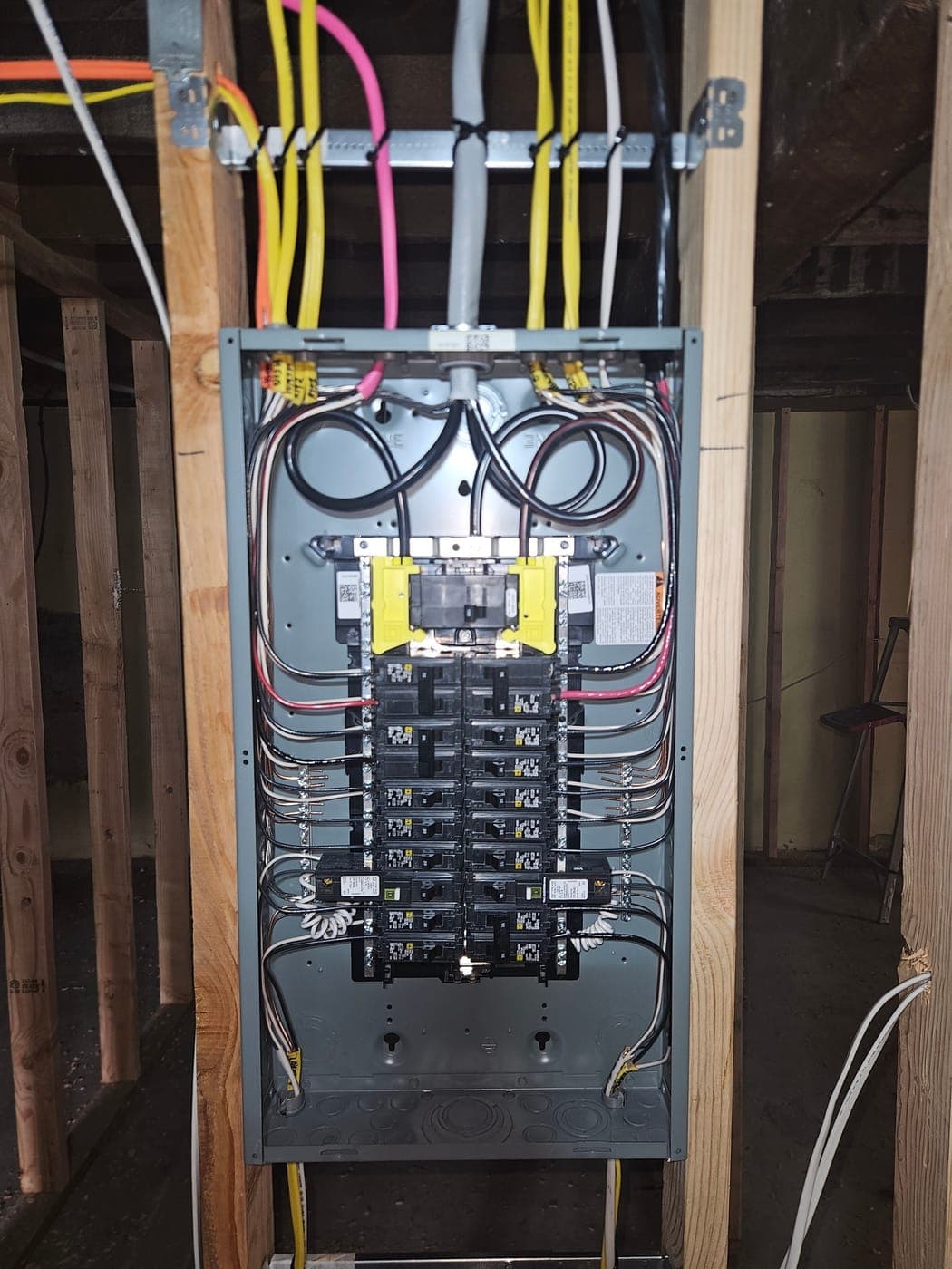 A 200 amp panel loaded and dressed in, its branch circuits combed out to both bus bars